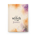 Basic Witch personalized journal open flat showing broomstick illustration and custom name