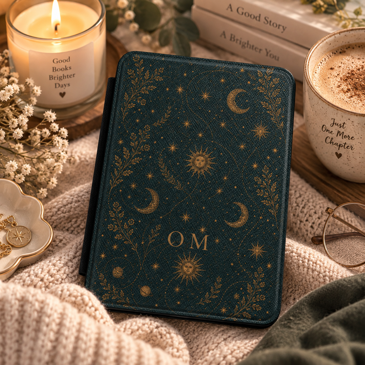Close-up of the sun and star linework on the celestial Kindle case