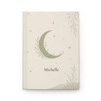 Celestial Moon personalized journal open flat showing custom name on sage-green cover with crescent moon illustration