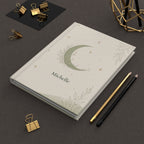 Celestial Moon journal held in hand to show size and portability