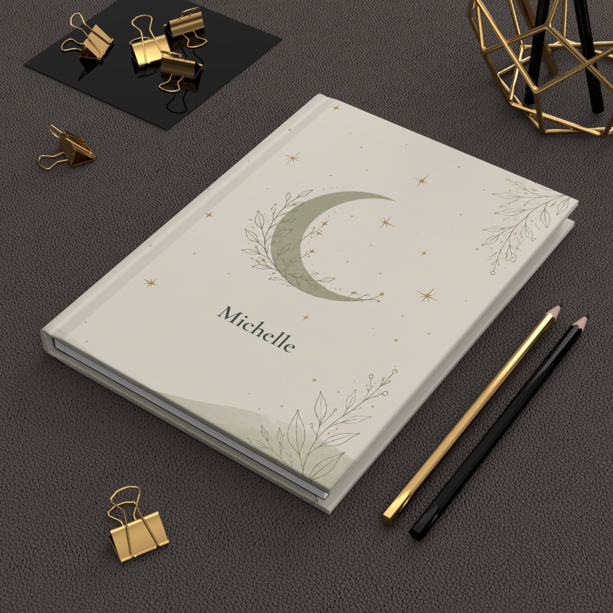 Celestial Moon journal held in hand to show size and portability
