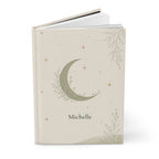 Close-up of the Celestial Moon journal cover showing botanical moon illustration and personalized name
