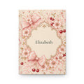 Cherry Blossom personalized journal open flat showing custom name on cover with pink floral and bow illustration