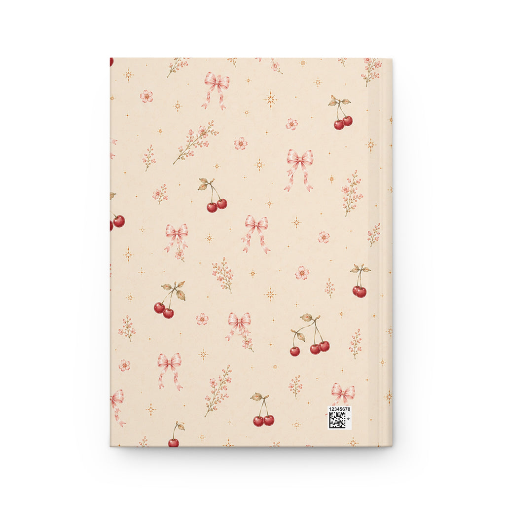 Cherry Blossom journal styled on a wooden desk with coffee and pen, flat lay
