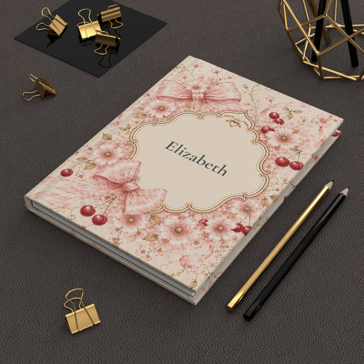 Cherry Blossom journal held in hand to show size and portability