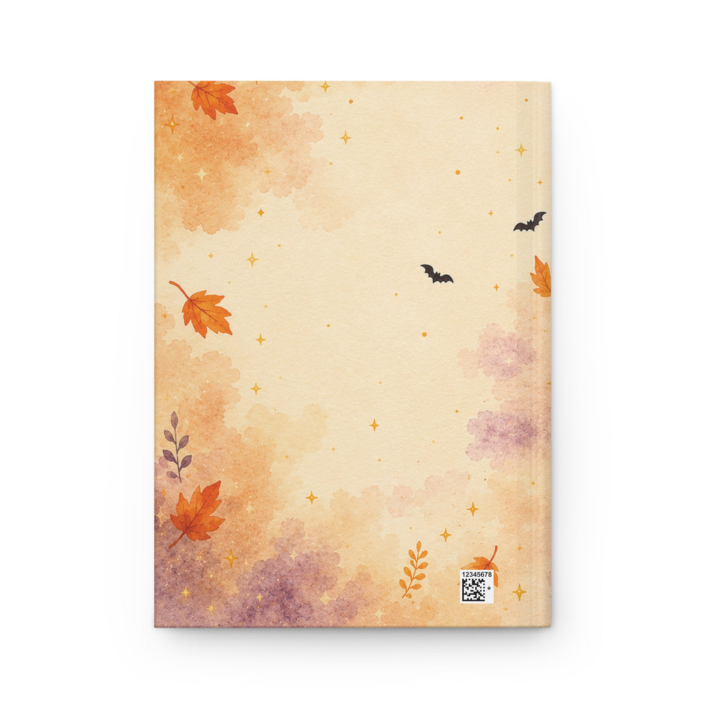 Happy Halloween journal styled on a wooden desk with coffee and pen, flat lay