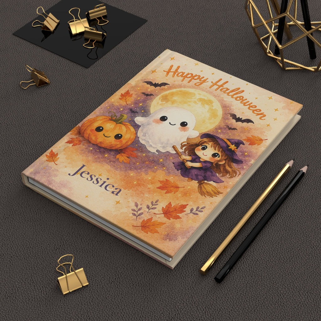 Happy Halloween journal held in hand to show size and portability