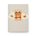 Ho Ho Ho personalized journal open flat showing custom name on cover with cute reindeer illustration