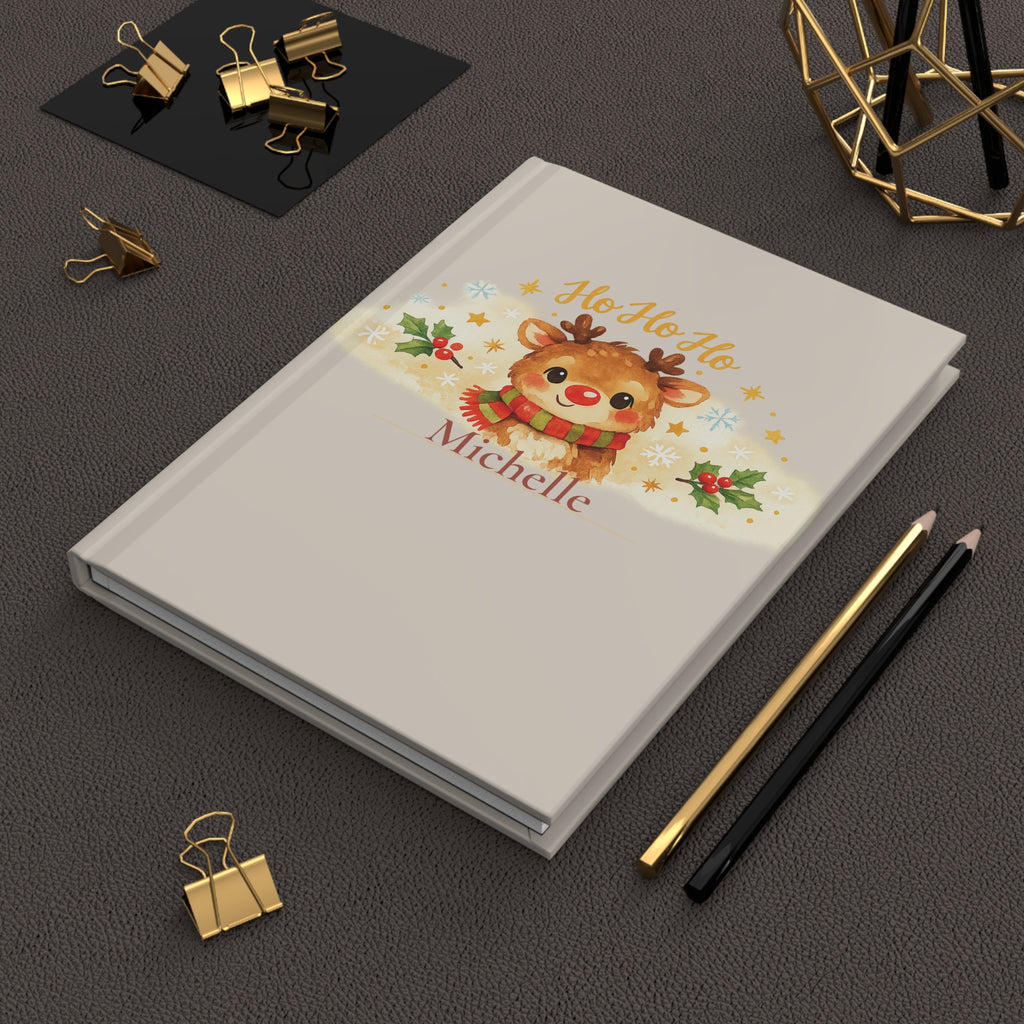 Ho Ho Ho journal held in hand to show size and portability