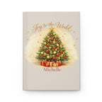 Joy to the World personalized journal open flat showing custom name on cover with Christmas tree illustration
