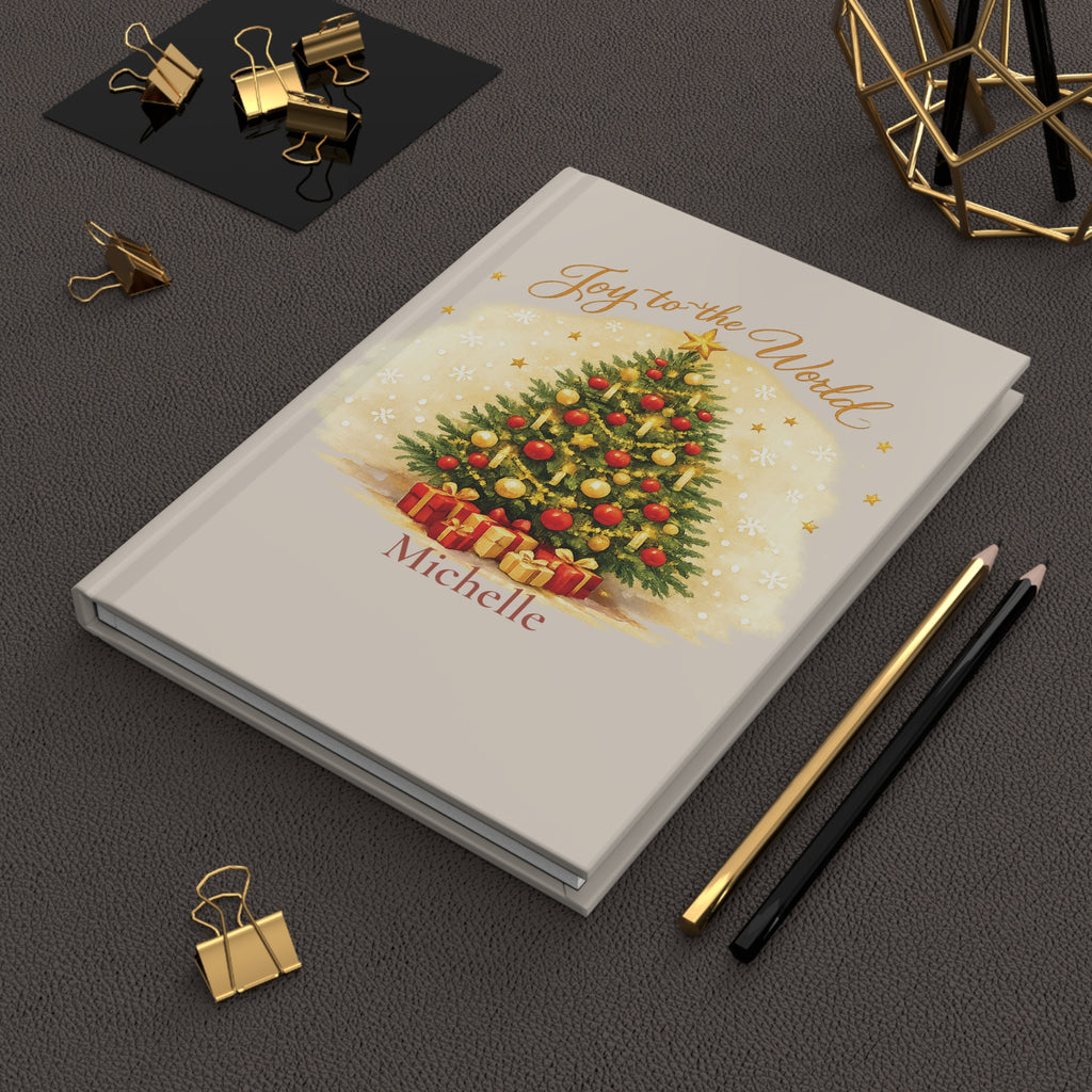 Joy to the World journal held in hand to show size and portability