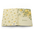 Lemon Blossom journal held in hand to show size and portability