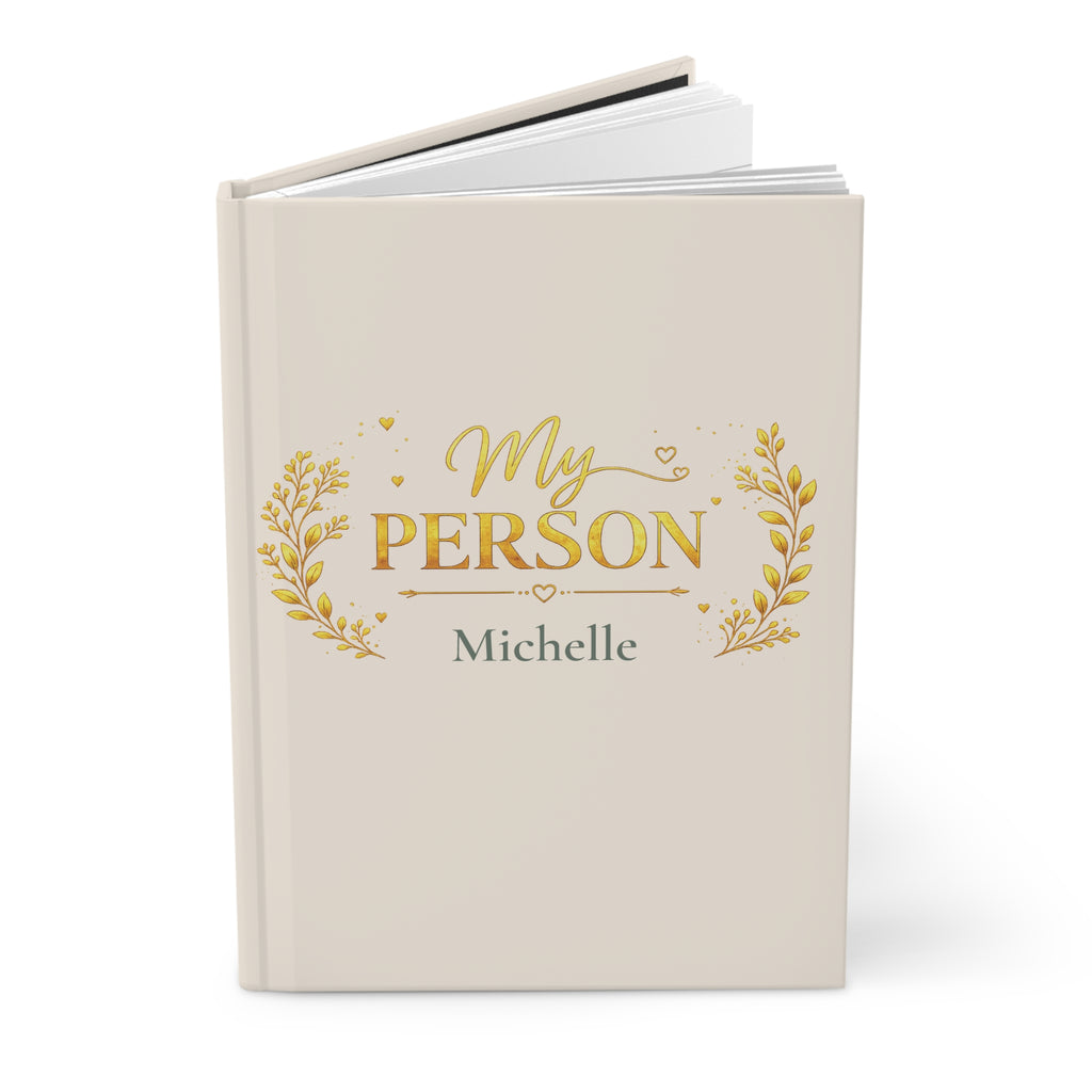 Close-up of the My Person journal cover showing gold laurel and heart detail with personalized name