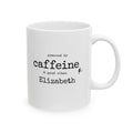 White ceramic mug reading Powered by Caffeine and Good Vibes with a personalized name
