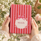 Close-up of the satin bow and peppermint details on the candy cane Kindle case