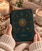 Close-up of the gold sun and orbiting planets illustration on the Kindle case
