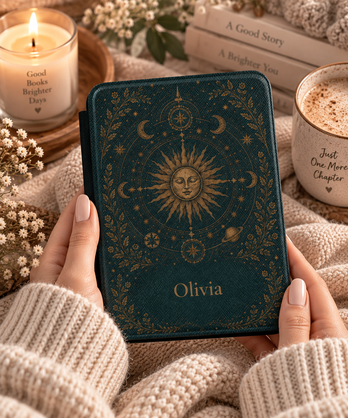 Close-up of the gold sun and orbiting planets illustration on the Kindle case