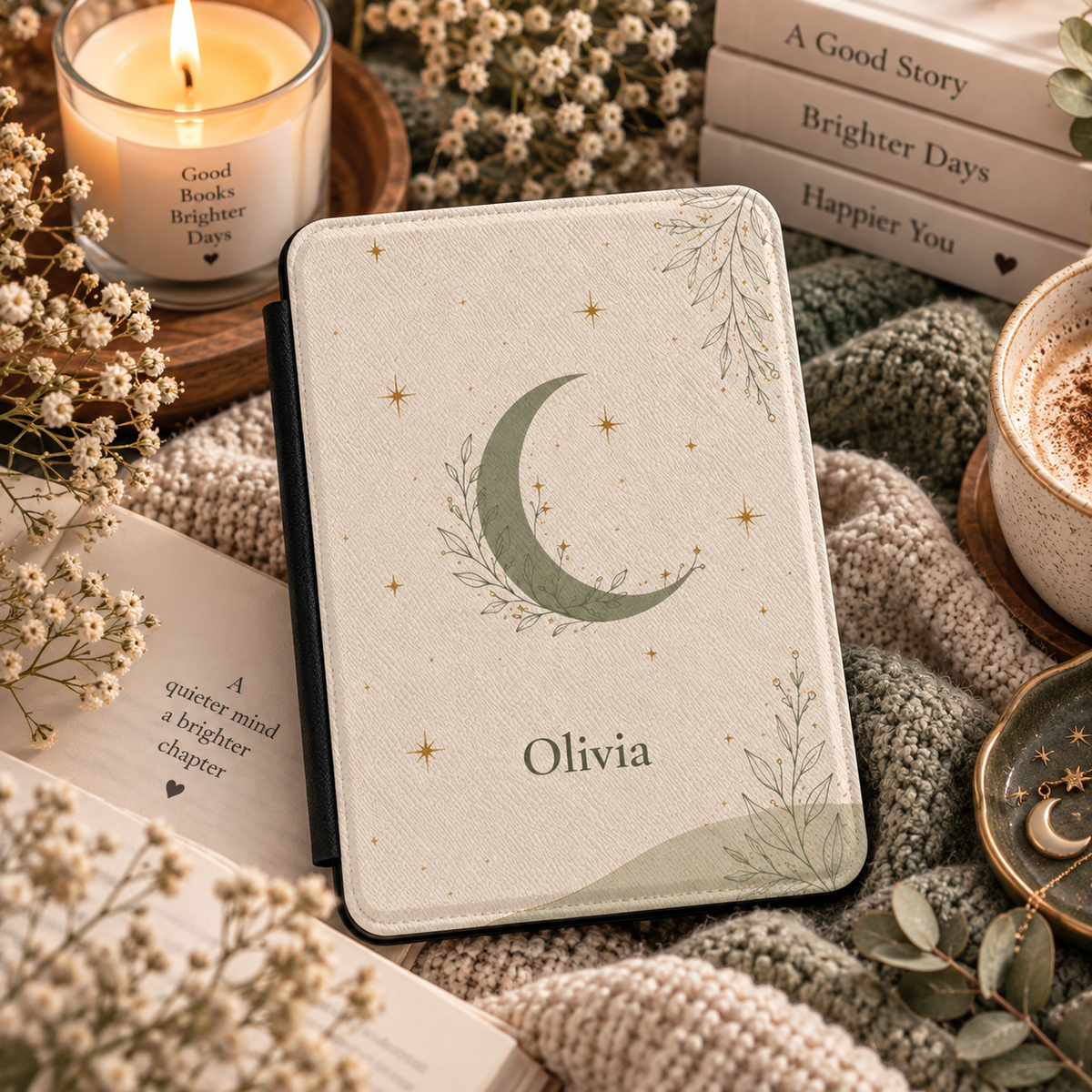 Close-up of the leaf-wrapped crescent moon illustration on the Kindle case