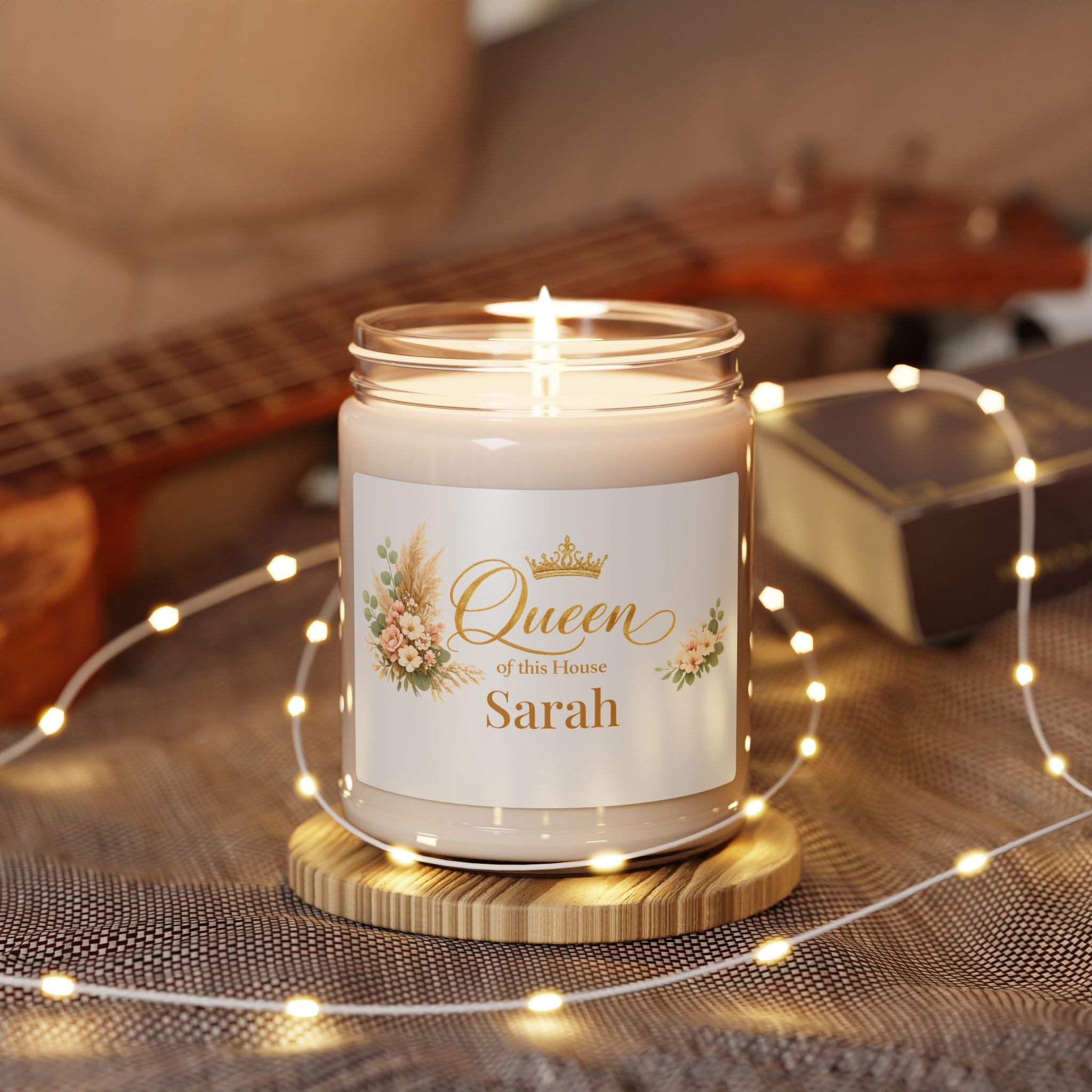 Personalized Queen of the House candle displayed in a cozy living room setting