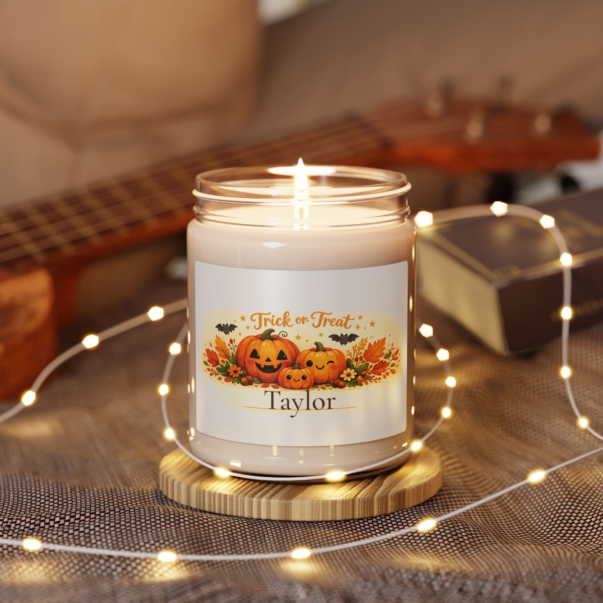 Personalized Trick or Treat candle displayed in a cozy living room setting