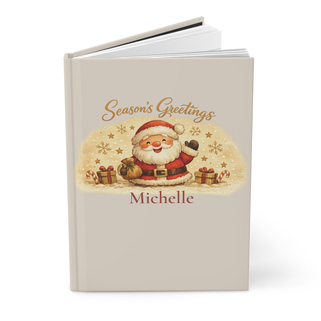 Close-up of the Season's Greetings journal cover showing Santa illustration and personalized name