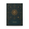 Sun and Moon personalized journal open flat showing custom name on dark teal cover with gold celestial illustration
