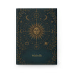 Sun and Moon personalized journal open flat showing custom name on dark teal cover with gold celestial illustration