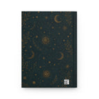 Sun and Moon journal styled on a wooden desk with coffee and pen, flat lay