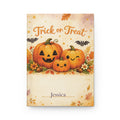 Trick or Treat personalized journal open flat showing custom name on cover with watercolor pumpkin illustration