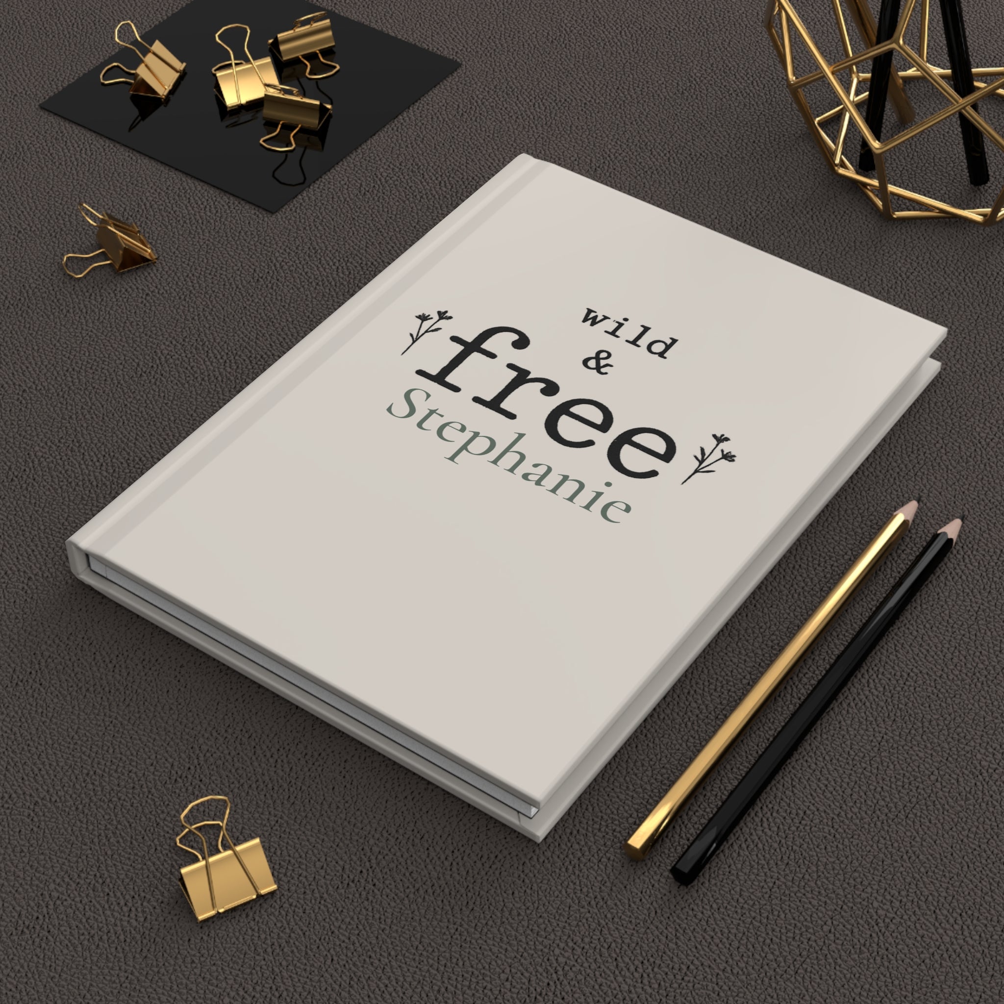 Wild & Free journal held in hand to show size and portability