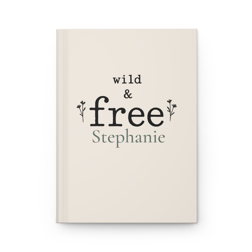 Wild & Free personalized journal open flat showing custom name on cream matte cover