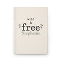 Wild & Free personalized journal open flat showing custom name on cream matte cover