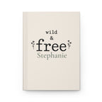 Wild & Free personalized journal open flat showing custom name on cream matte cover