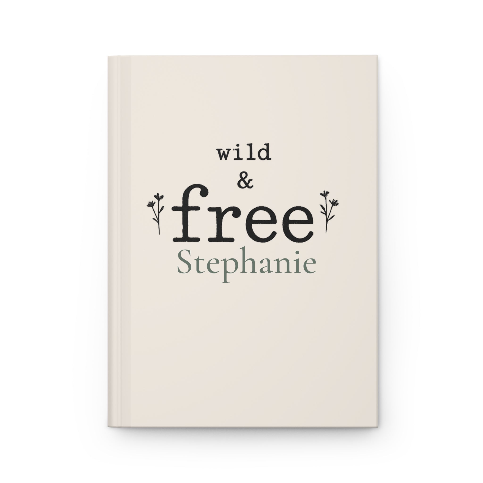 Wild & Free personalized journal open flat showing custom name on cream matte cover