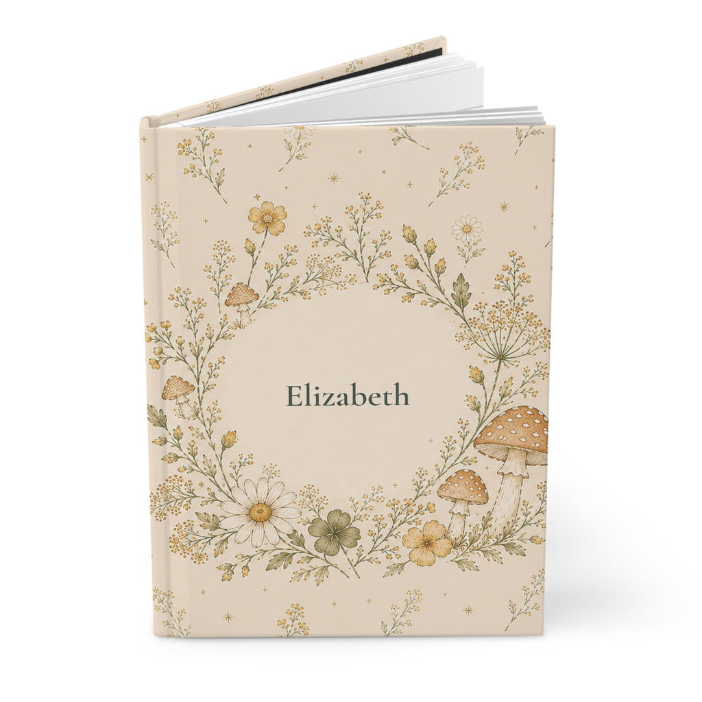 Close-up of the Wildflower and Mushroom journal cover showing botanical illustration and personalized name