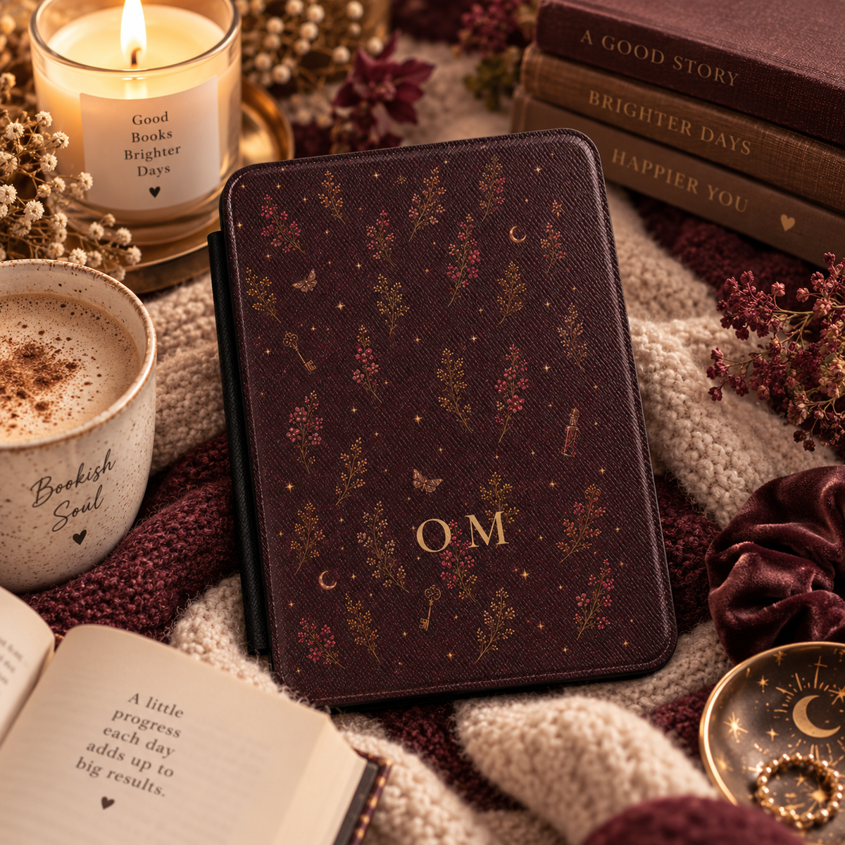 Close-up of the moth and key illustrations on the witchy Kindle case