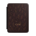 Witchy floral Kindle case with monogram, moth and key details on merlot background