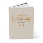 Close-up of the World's Best Husband journal cover showing gold laurel wreath and personalized name